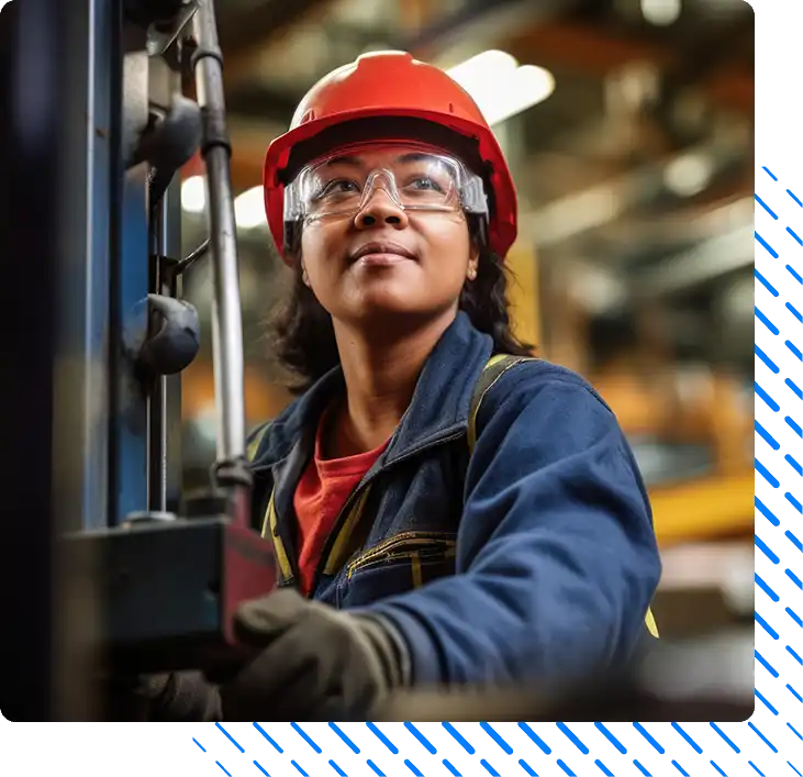 Woman working on factory machinery