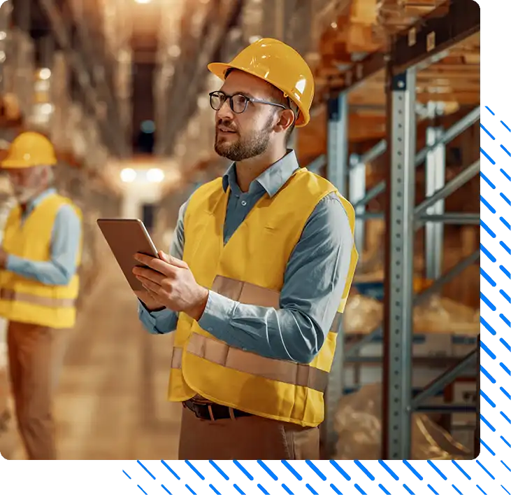 Two employees with tablet at logistics center warehouse