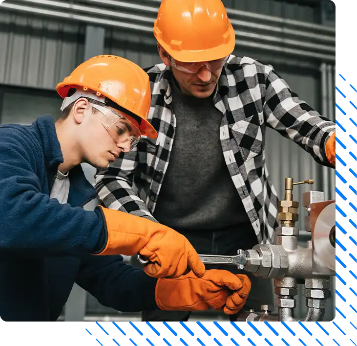 Male Workers Repairing Industrial Pipe System Male Workers Repairing Industrial Pipe System