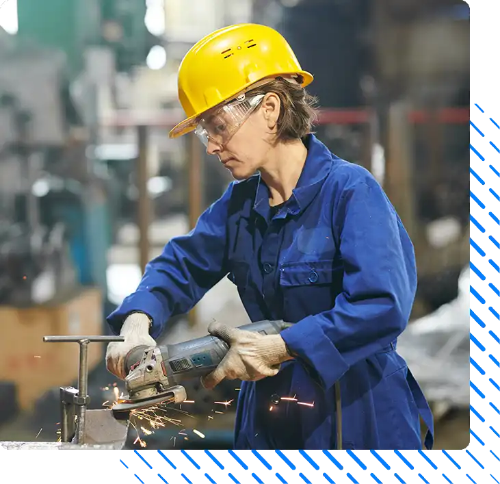 Side view portrait of female worker cutting metal