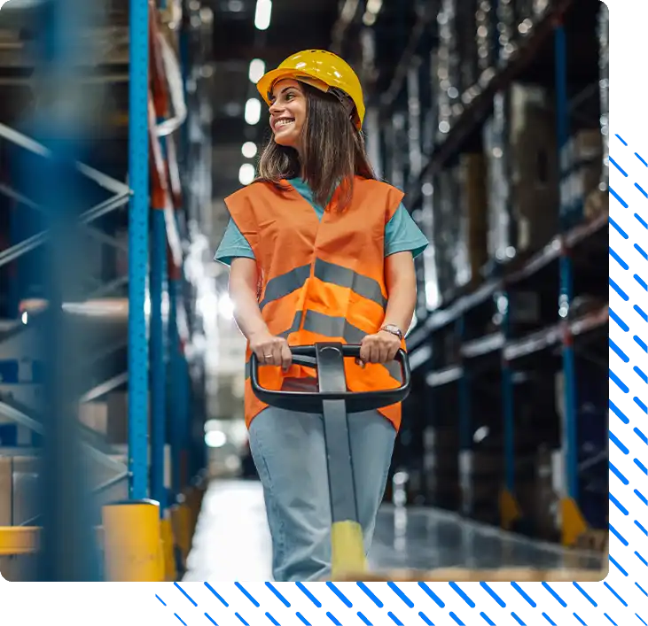 Female warehouse worker pulling pallet jack Female warehouse worker pulling pallet jack