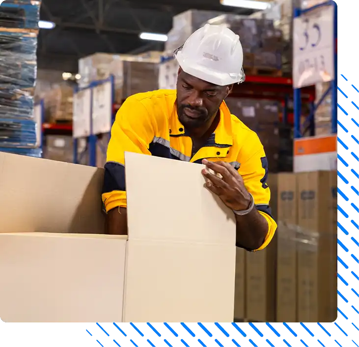 Warehouse packer applies fragile label