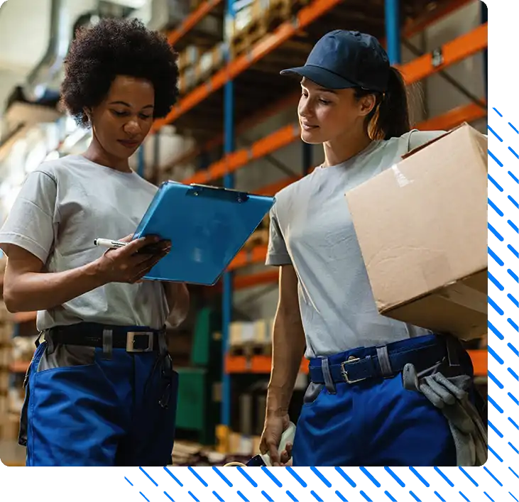 female warehouse workers going through shipment list