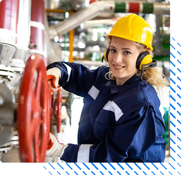 refinery worker working by pipeline and valves